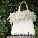 Handtasche aus cremefarbener Wolle mit Federrand. Innenfutter gold-orange. 238.-€